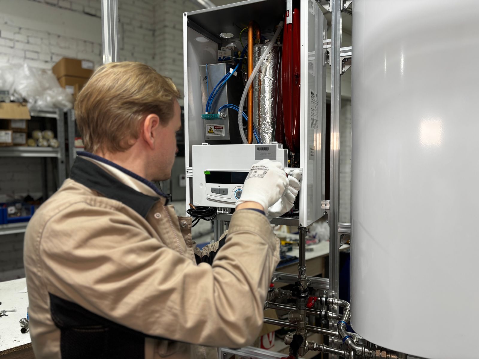 Technician repairing a home water heater, illustrating whether a home warranty covers water heater replacement