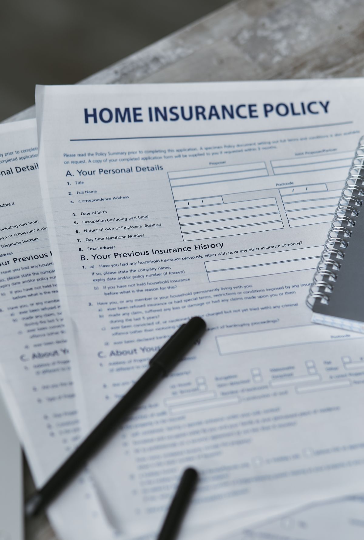 Claim form and pen on a desk, a guide to handling a denied home warranty claim