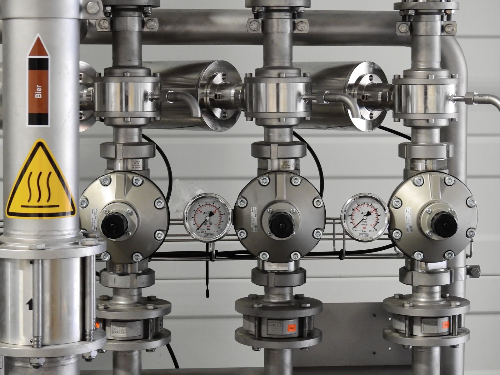 Does a home warranty cover a well pump? Pressure gauge on stainless steel pipes in a water system